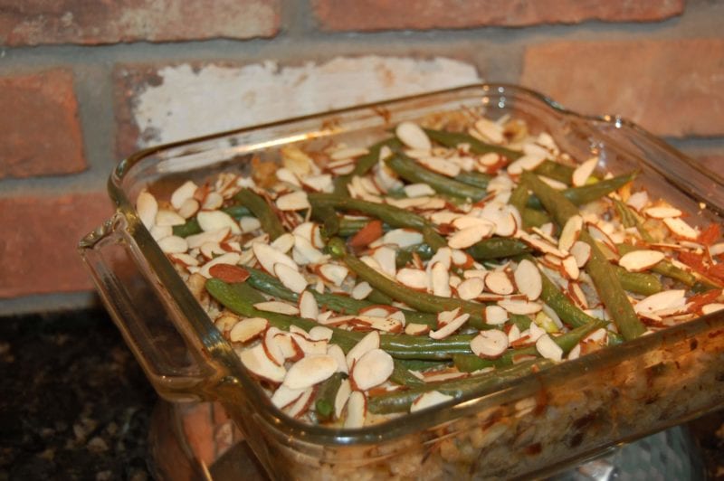 Homemade chicken casserole with green beans and almonds on top.