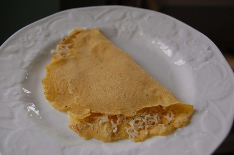 Homemade cheese quesadilla on corn tortilla.