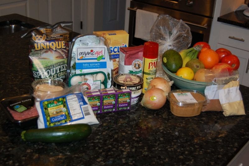 Groceries from Earth Fare that included fresh produce, cheese, meat, pretzels, crackers, flour, and more.