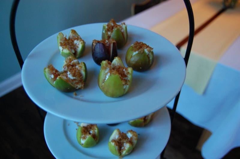 Goat cheese stuffed figs on a serving tray.