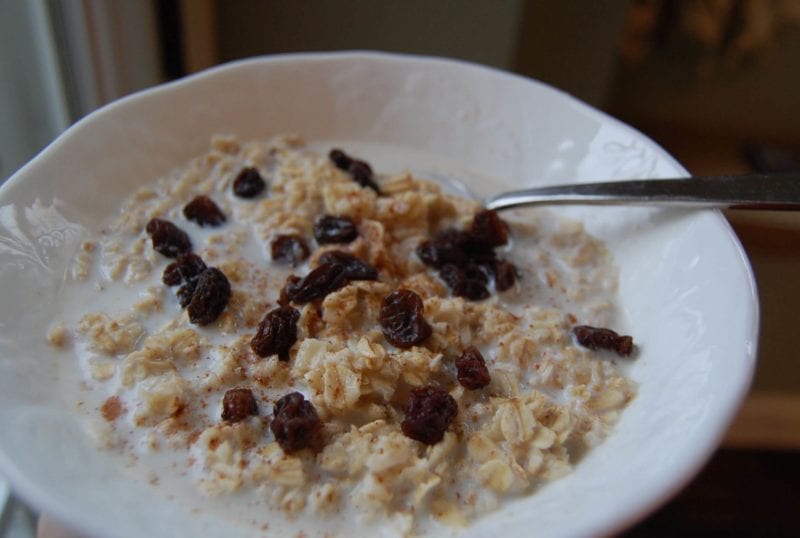 Homemade oatmeal topped with raisins.