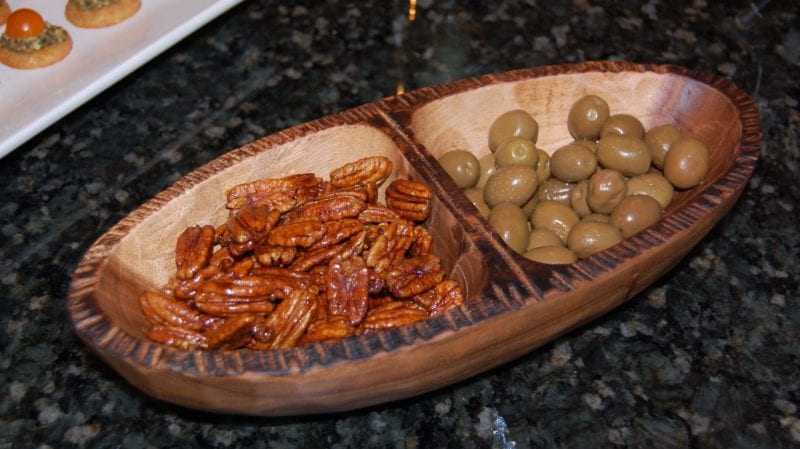 Candied pecans and ostatu rioja blanco in a serving tray.