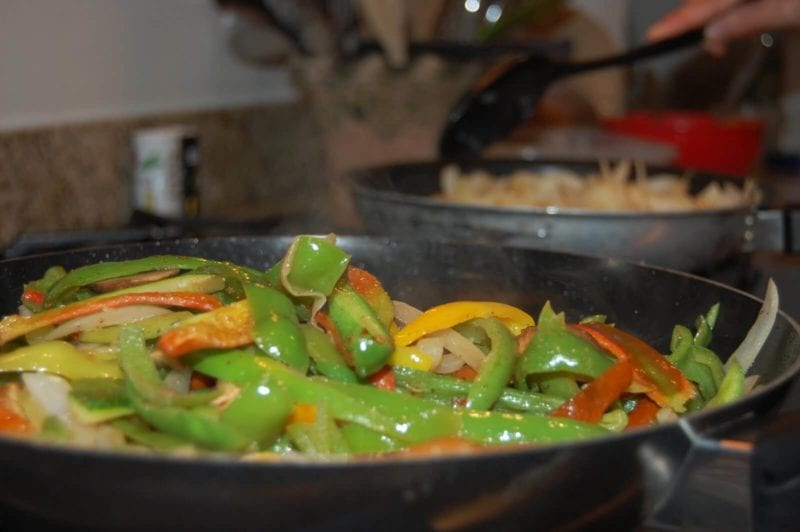 Veggies for fajitas cooking on the stove.